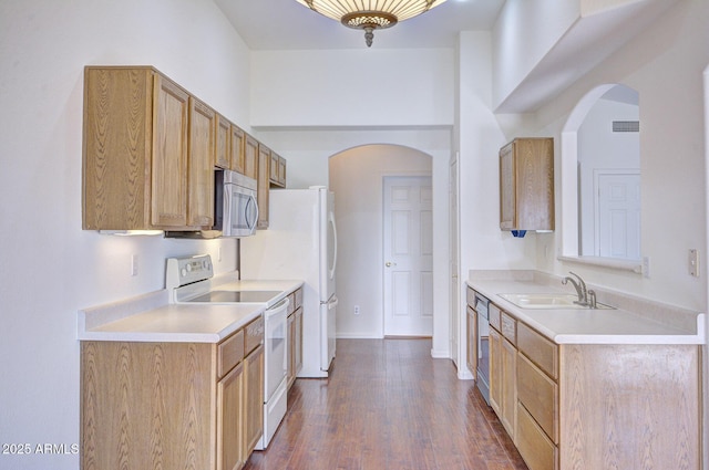 kitchen featuring dark hardwood / wood-style flooring, sink, and stainless steel appliances