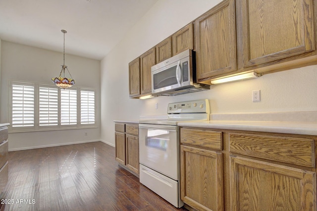 kitchen with dark hardwood / wood-style floors, decorative light fixtures, and white electric range