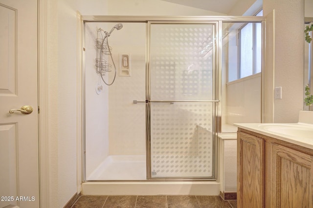 bathroom with vanity and walk in shower