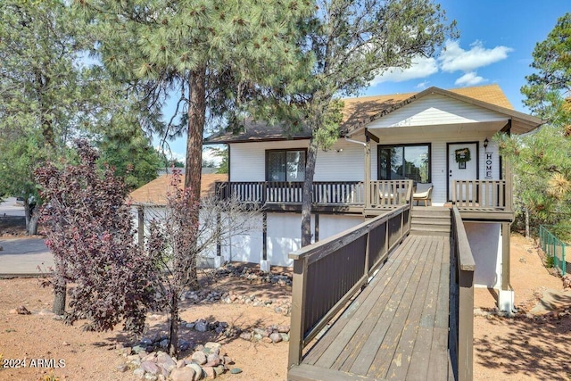 bungalow-style home with a deck