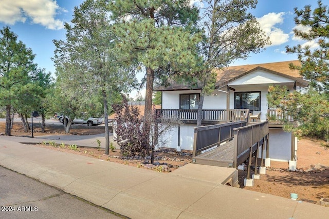 view of front of home featuring a wooden deck