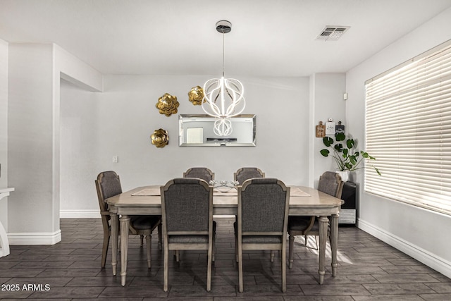 dining area featuring an inviting chandelier