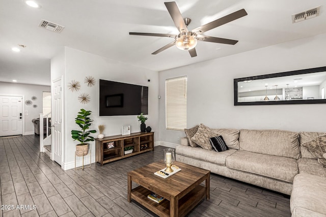 living room with ceiling fan and hardwood / wood-style floors