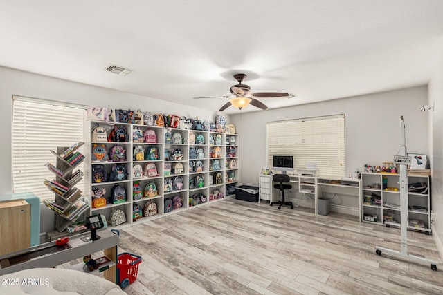 office space with hardwood / wood-style floors and ceiling fan