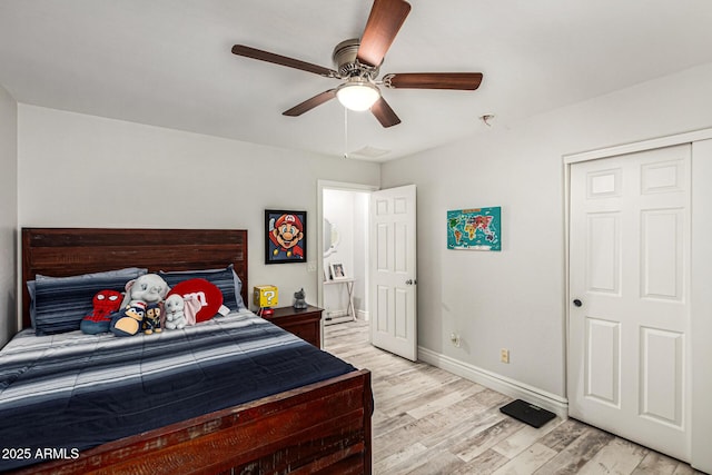 bedroom with ceiling fan and light wood-type flooring