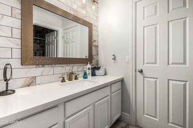 bathroom with vanity and decorative backsplash