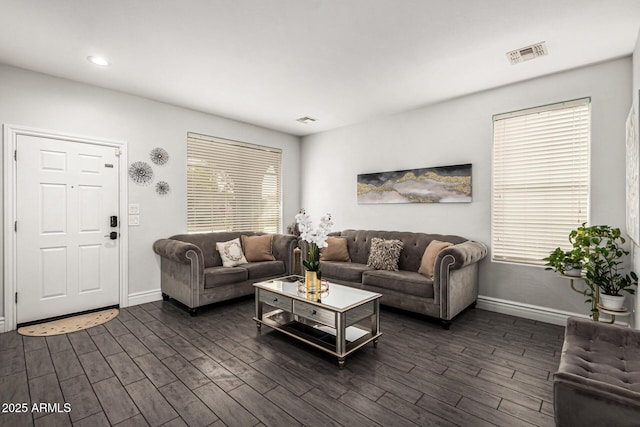 living room with dark hardwood / wood-style flooring