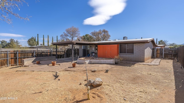 back of property with a patio area