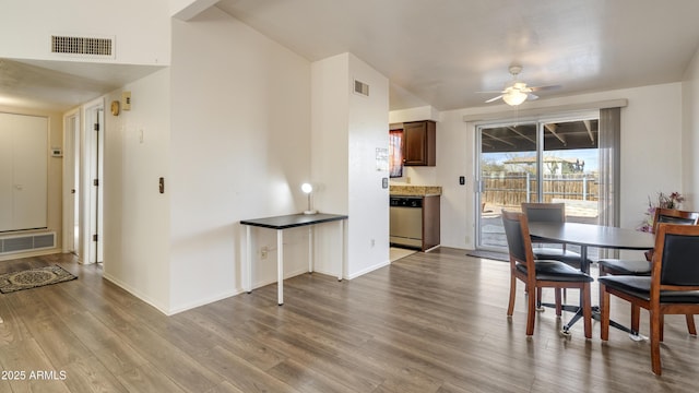 dining area with ceiling fan and light hardwood / wood-style floors