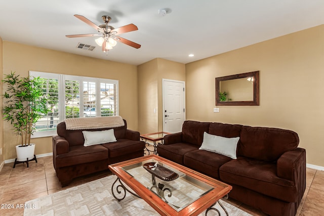 tiled living room featuring ceiling fan