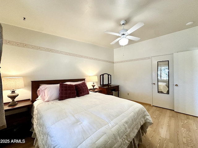 bedroom featuring ceiling fan and light hardwood / wood-style flooring