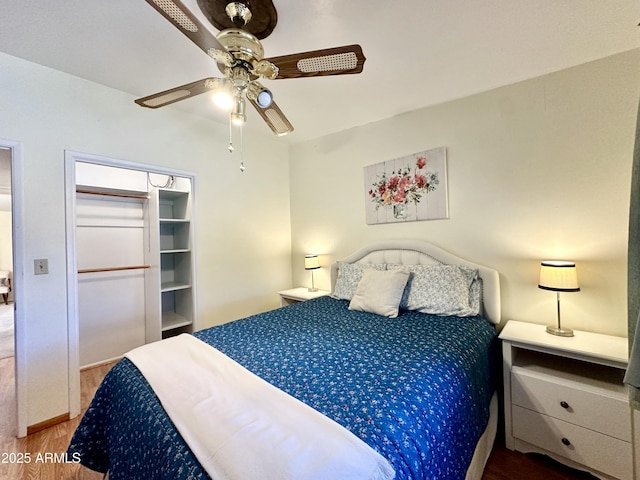 bedroom with wood-type flooring and ceiling fan