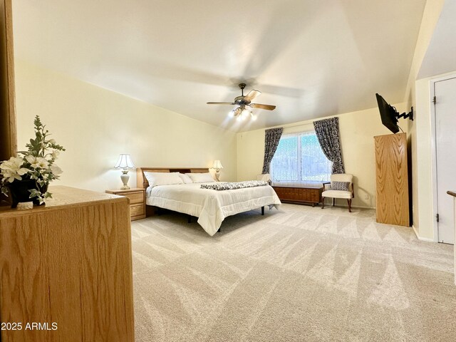 carpeted bedroom with lofted ceiling and ceiling fan