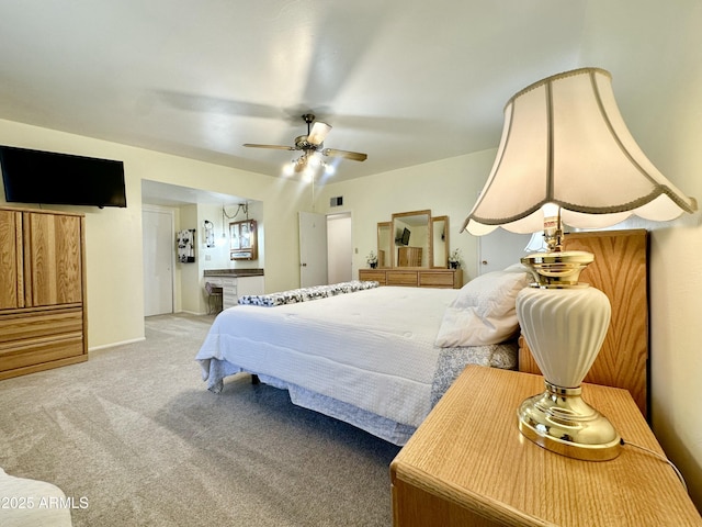 bedroom featuring light carpet and ceiling fan