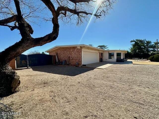 ranch-style house featuring a garage