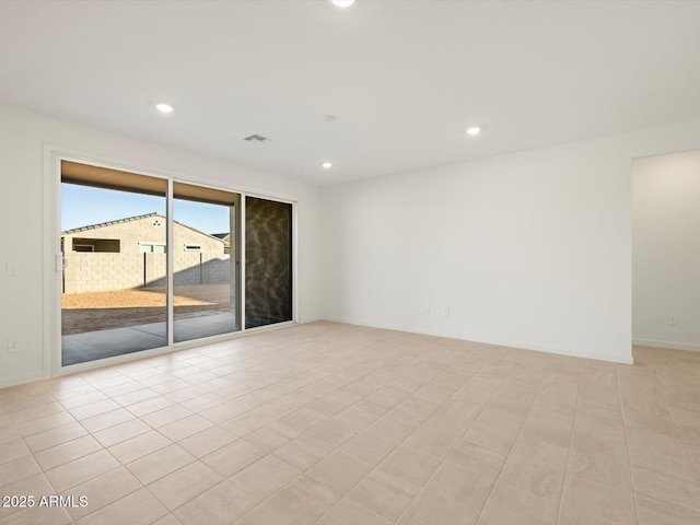 unfurnished room featuring light tile patterned floors