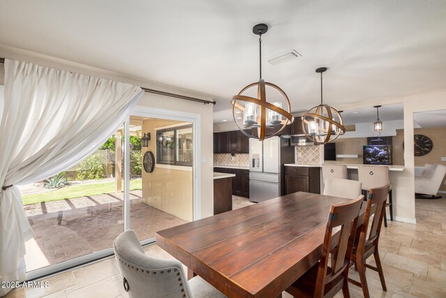 2256 S Las Flores, Mesa, AZ 85202 - dining room with a chandelier and stone tile flooring
