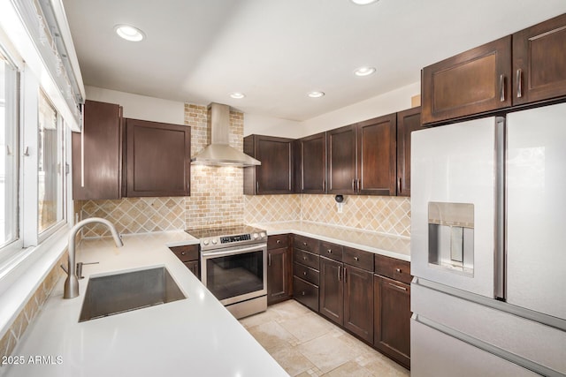 2256 S Las Flores, Mesa, AZ 85202 - kitchen with white refrigerator with ice dispenser, wall chimney exhaust hood, electric stove, a sink, and light countertops