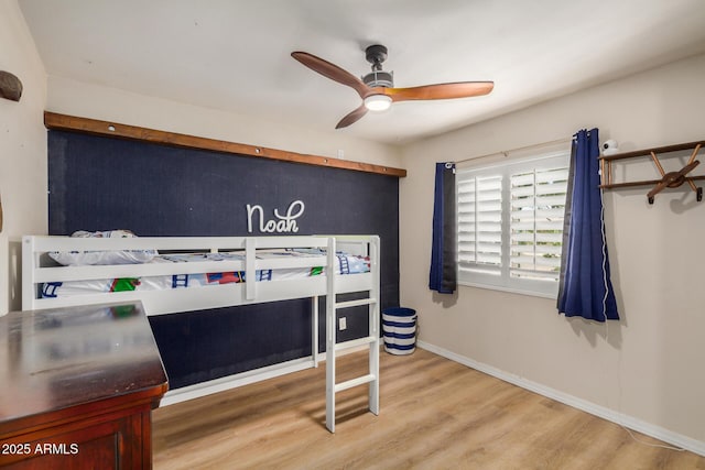 2256 S Las Flores, Mesa, AZ 85202 - bedroom with wood finished floors, baseboards, and a ceiling fan