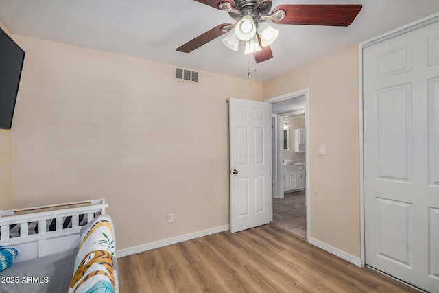 2256 S Las Flores, Mesa, AZ 85202 - bedroom with light wood-type flooring, baseboards, and a ceiling fan