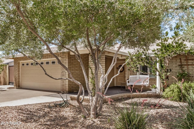 2256 S Las Flores, Mesa, AZ 85202 - view of front of house featuring concrete driveway, a garage, and a porch