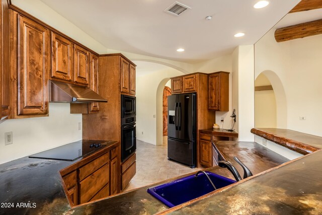 kitchen with sink and black appliances