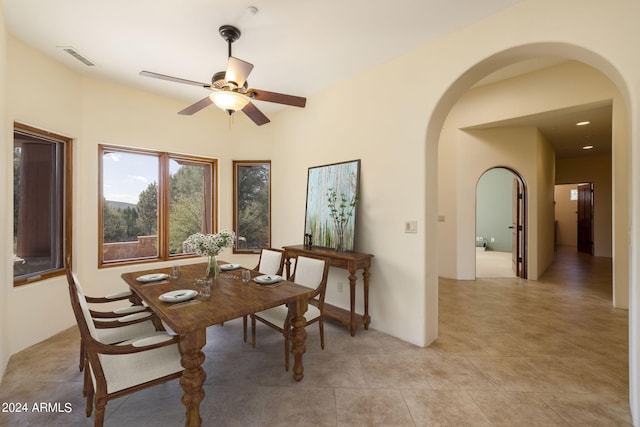 dining room featuring light tile patterned floors and ceiling fan