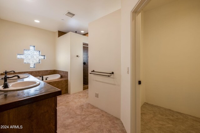 bathroom featuring vanity, tile patterned floors, and separate shower and tub