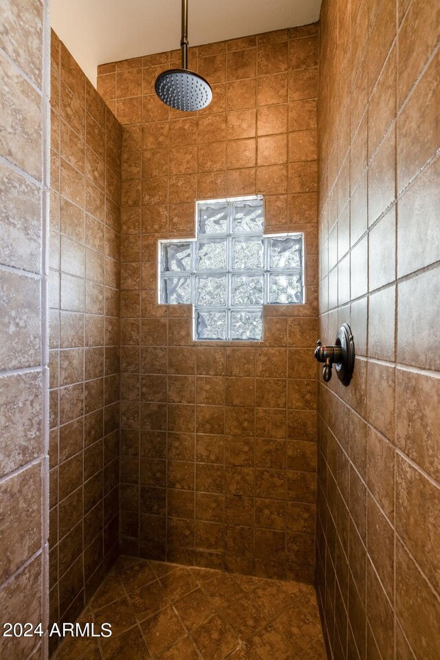 bathroom with tiled shower