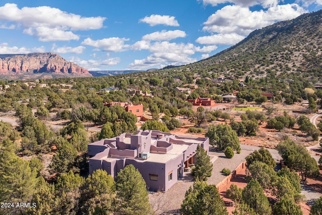 birds eye view of property featuring a mountain view