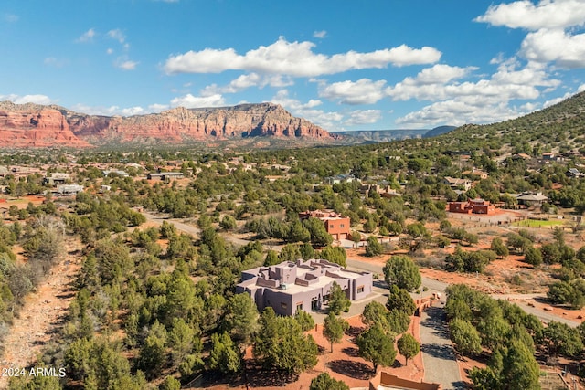 birds eye view of property with a mountain view