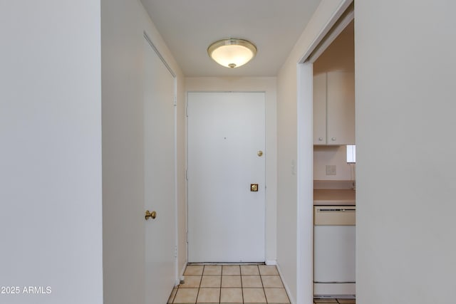 doorway to outside featuring light tile patterned floors