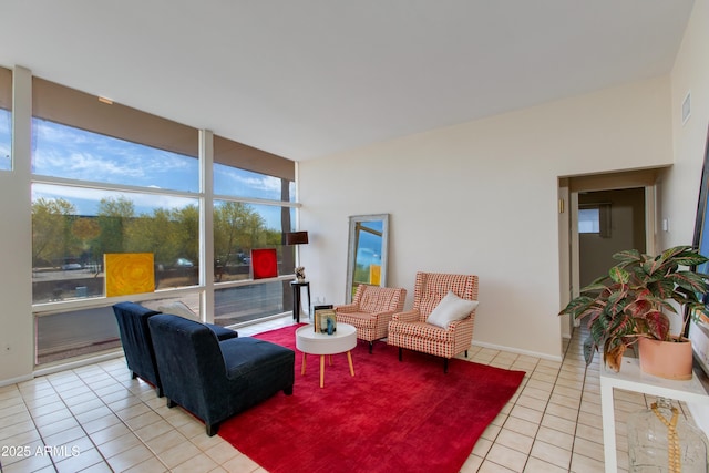 living area featuring light tile patterned floors and visible vents