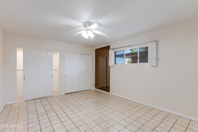 unfurnished bedroom featuring a ceiling fan and baseboards