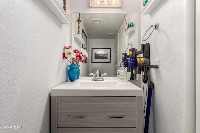 1401 E Puget Ave Unit 4, Phoenix, AZ 85020 - bathroom with a textured wall and vanity