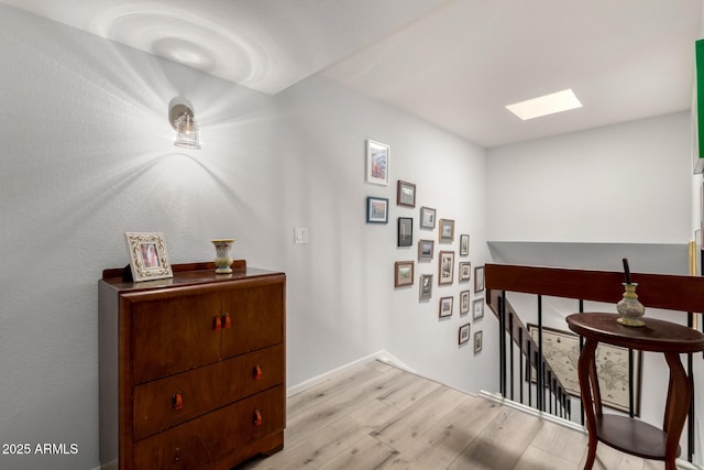 1401 E Puget Ave Unit 4, Phoenix, AZ 85020 - hall featuring light wood-style flooring and an upstairs landing