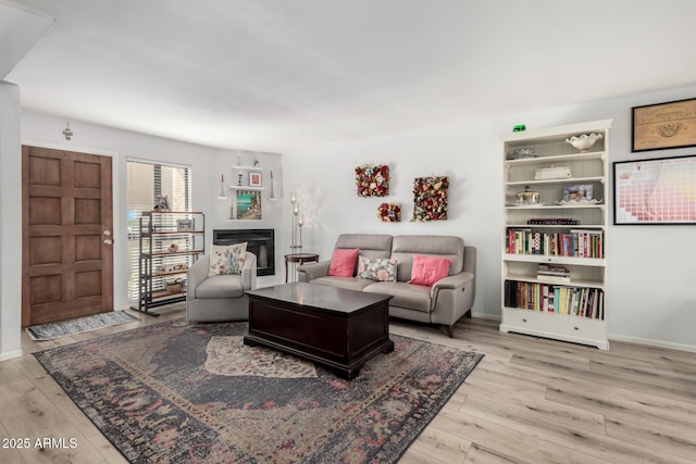 1401 E Puget Ave Unit 4, Phoenix, AZ 85020 - living area with wood finished floors, baseboards, and a fireplace