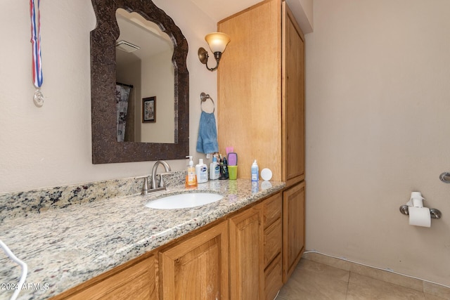 bathroom featuring visible vents, vanity, and tile patterned floors