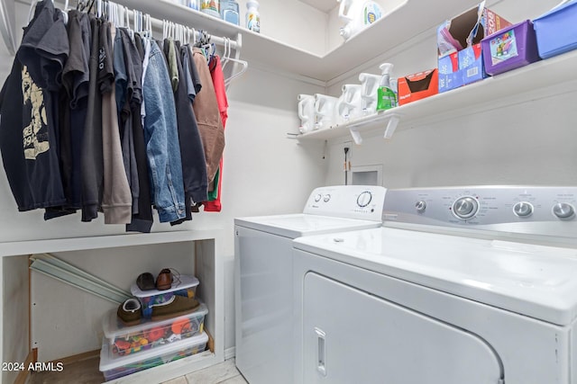 washroom featuring laundry area and washing machine and clothes dryer