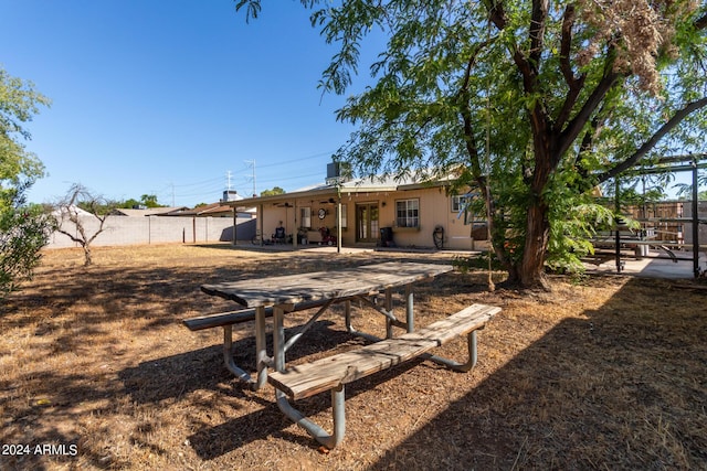 back of house with fence private yard, french doors, and a patio area