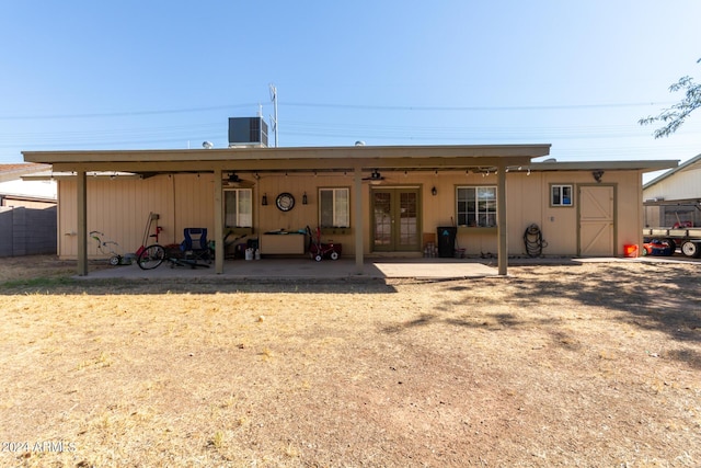 rear view of property featuring ceiling fan, french doors, a patio area, and central air condition unit