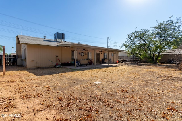 rear view of property featuring central AC unit and a patio