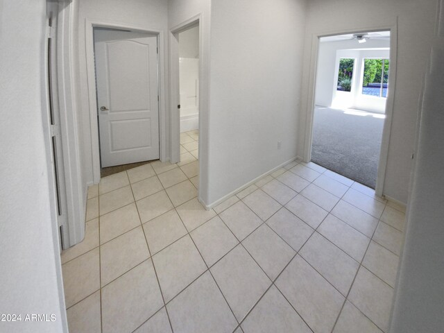 hallway with light tile floors