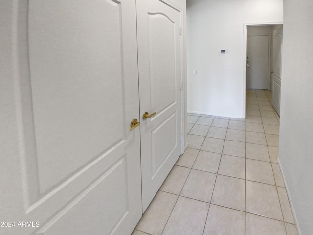 hallway with light tile flooring