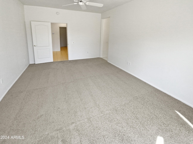 unfurnished bedroom with ceiling fan and carpet flooring