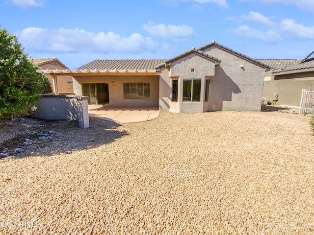 back of house with a patio area