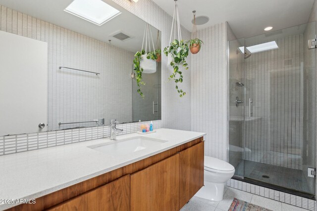 110 W Missouri Ave Unit 18, Phoenix, AZ 85013 - bathroom featuring a shower stall, vanity, toilet, tile patterned flooring, and recessed lighting