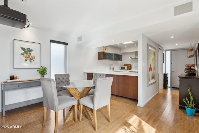 110 W Missouri Ave Unit 18, Phoenix, AZ 85013 - dining space with light wood finished floors, recessed lighting, and baseboards
