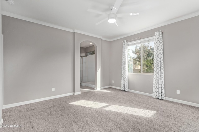 unfurnished room with ornamental molding, carpet floors, and ceiling fan