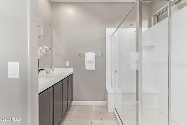 bathroom featuring walk in shower, tile patterned floors, and vanity